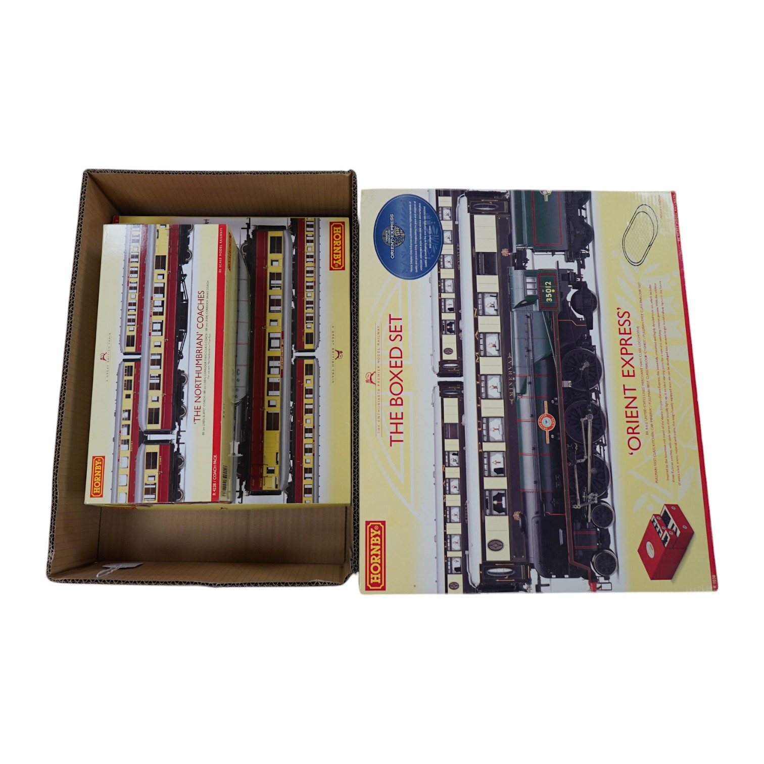 A Hornby Hobbies 00 gauge railway ‘the Northumbrian’ train pack, R2435, together with ‘the Northumbrian Coaches’ coach pack, R4228, comprising of a BR Class A4 locomotive and six maroon and cream coaches. Condition - goo